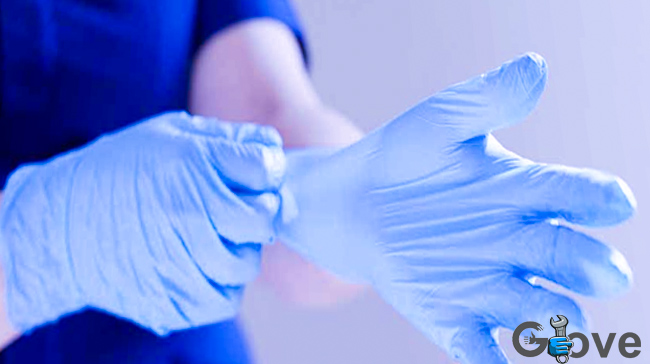 A-healthcare-worker-donning-a-pair-of-neoprene-gloves.jpg